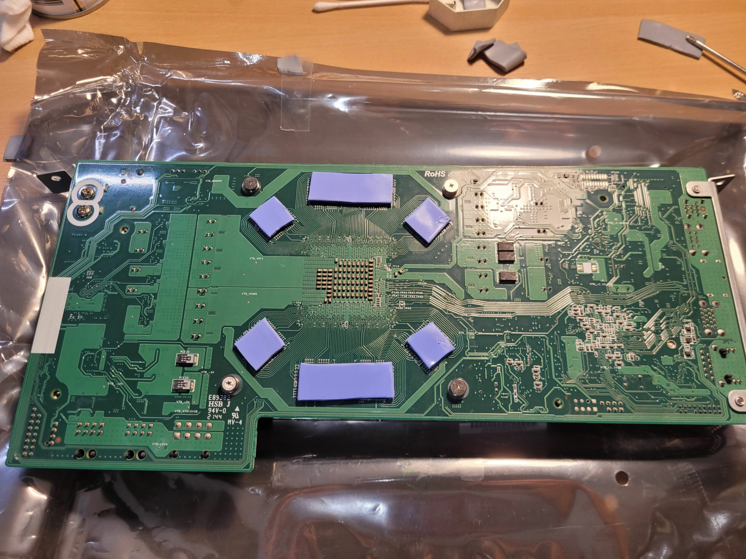 Back of the BC-250 board with new thermal pads on the memory chips