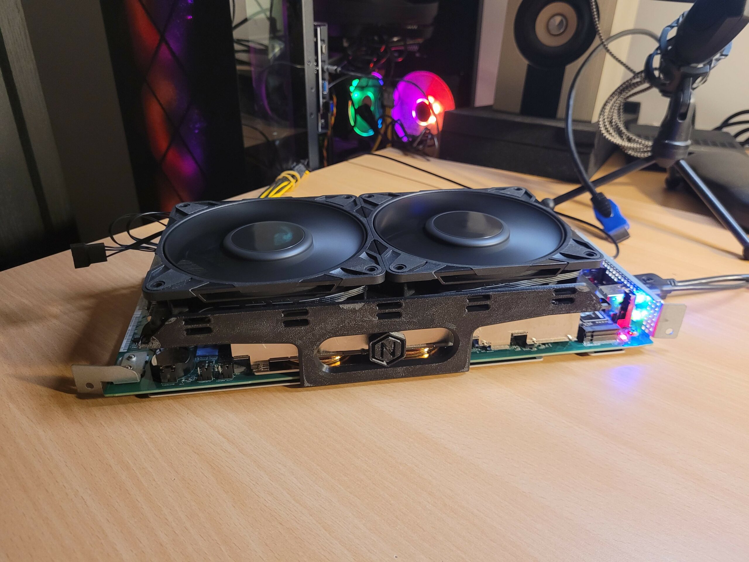 AMD BC-250 fitted with two fans and 3D-printed supports