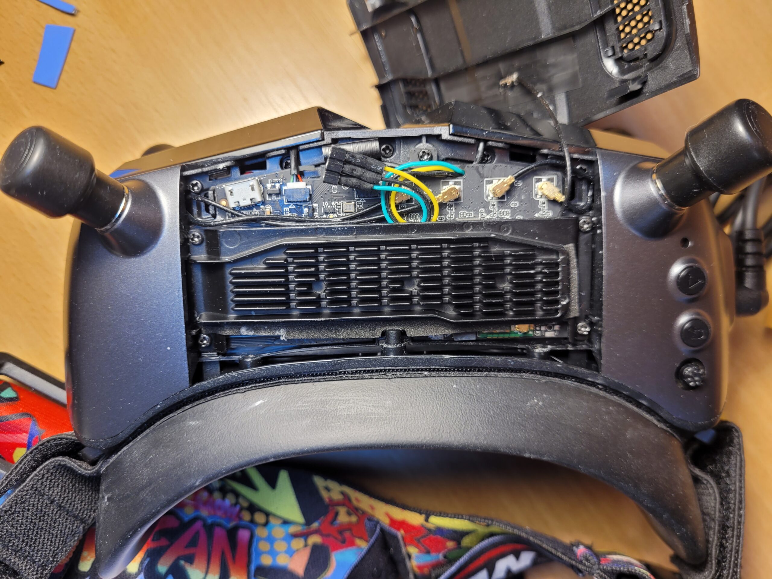Top rear view of Walksnail Avatar X goggles showing an accessible UART debug connector