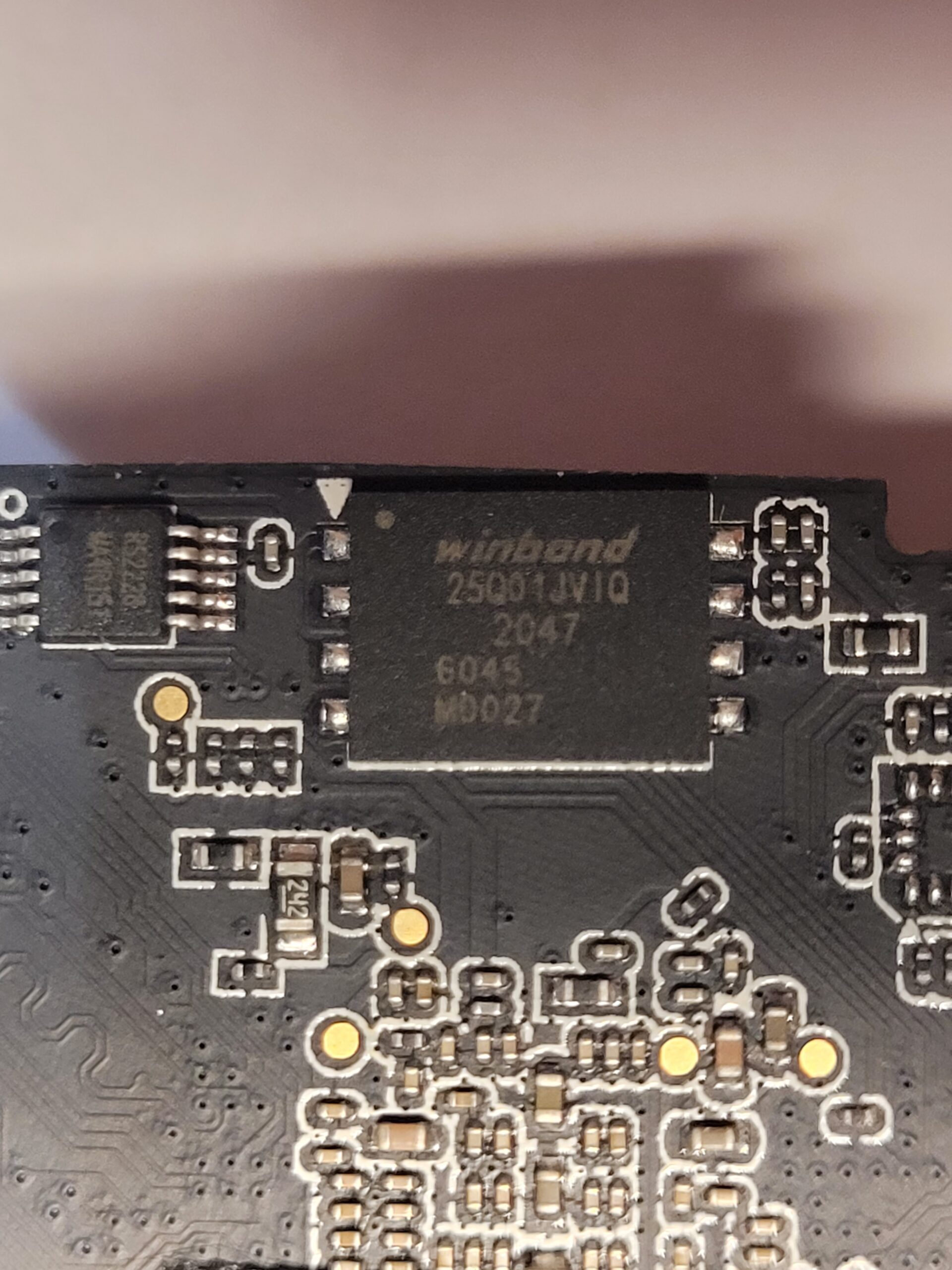Close-up of the Winbond W25Q01JV QSPI flash on the Walksnail Avatar X mainboard